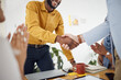 © Wesley/peopleimages.com - Creative people, handshake and meeting in hiring, b2b or partnership and applause in teamwork at office. Happy employees shaking hands in team recruiting, agreement or deal in startup at workplace