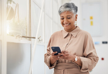 senior woman, phone text and networking in a office with a smile and mobile planning for digital wor