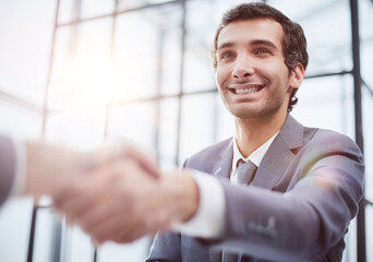 Wall Mural - close up.businessman shaking hands with his business partner