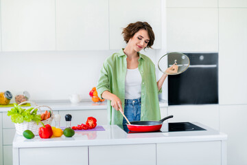 Sticker - Photo of charming positive girl enjoy cooking home hands hold frying pan cover wooden spatula bright kitchen room inside