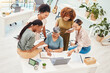 © Anela/peopleimages.com - Business women, meeting and computer planning, design teamwork or brainstorming for office website ideas. Group of women in collaboration and notebook or writing goals for branding with laptop above