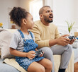 Father, daughter and gaming controller on sofa with challenge, press and competition for bonding in house. Man, girl child and playful with esports, contest and strategy with thinking in family home