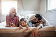 © ivanko80 - Family have fun in bedroom