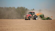 © andrey gonchar - Modern tractor sowing directly into the ground with equipment using GPS for precision farming in the fields