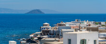 View Of Sea And Whitewashed Buildings And Rooftops Of Mandraki, Mandraki, Nisyros, Dodecanese, Greek Islands, Greece