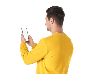 Wall Mural - Man holding smartphone with blank screen on white background