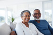 © Jasmina - Portrait of a happy, smiling black senior couple at family gathering indoors