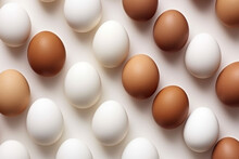 White eggs pattern with brown egg on white background.