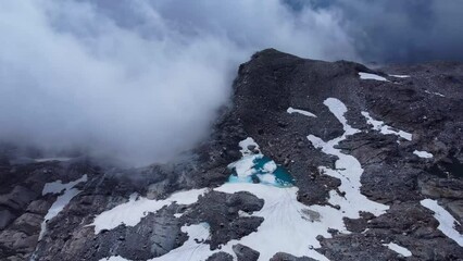 Poster - flight on the edge of a snowy mountain with a blue lake