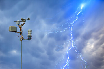 Wall Mural - weather station automatic measurement of weather parameters with stormy sky and rain and lightning