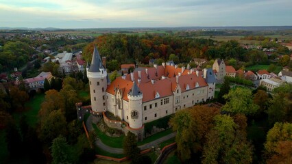 Wall Mural - Drone view above the Chateau Zleby between trees in autumn in Zleby, Czech Republic