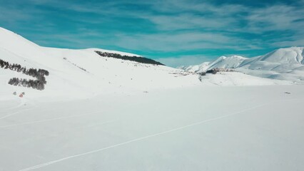 Sticker - Aerial video of the tall rocky mountains covered with snow