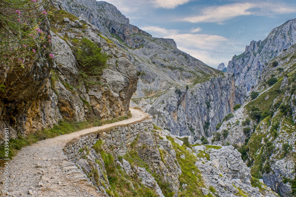 The Narrow Hiking Trail Winding Along The Rock Face In The Ruta Del