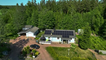 Poster - Aerial view of a engineer inspecting solar panels on a house roof, sunny, summer day