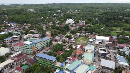 Sticker - Drone cityscape view with trees and green landscape in the background