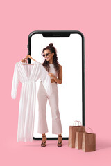 Canvas Print - Stylish woman with new dress and shopping bags near big mobile phone on pink background