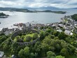 Aerial view of McCaig's Tower and Battery Hill, located in Oban, Scotland
