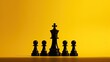 © HN Works - Black chess piece with king s silhouette on yellow backdrop