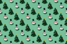 Creative Christmas Pattern Made Of Snowmen And Paper Pine Tree