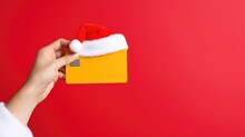 Santa Clause Presents An Empty Credit Card In A Studio  - Christmas Themed Stock Photo