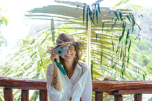 Woman With Point And Shoot Camera On Vacation