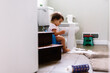 © Maria Manco/Stocksy - Toddler goes to the bathroom