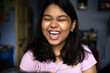 © Dream Lover/Stocksy - Teenage girl smiling and looking happy inside a house