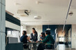 © Studio Firma/Stocksy - Businesspeople Having Meeting in Office