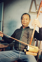 The Man Closed His Eyes And Played The Erhu

