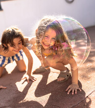 Kids Playing With Bubbles