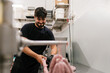 © Ezequiel Giménez/Stocksy - Serious man making sausages with professional equipment