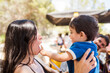 © Ibai Acevedo/Stocksy - Funny portrait of baby playing with mother face