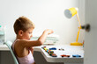 © Albert Martinez/Stocksy - Kid playing with toys at home