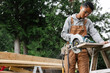 © Rob and Julia Campbell/Stocksy - Carpenter cutting with skill saw on the jobsite.