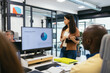 © Pedro Merino/Stocksy - Female boss talking to the workers of her company in a modern office