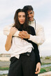 © Berena Alvarez/Stocksy - Young and modern couple at sunset