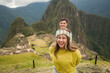 © Carlos Gonzales/Stocksy - Young couple in Machu Picchu, Peru