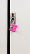 © Vera Lair/Stocksy - Fluorescent pink padlock