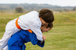 © ByLorena/Stocksy - Friends practicing judo in nature