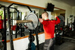 © Boris Jovanovic/Stocksy - Disabled man exercises in front of a mirror