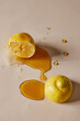 © Nicole Mason/Stocksy - Lemon Halves with Honey Drizzles and Drops