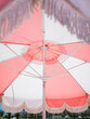 © Lexia Frank/Stocksy - pink sunshade umbrella