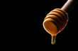 © Leonardo Borges Nuñez/Stocksy - honey stick with dripping honey
