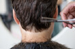 © Anfisa&friends/Stocksy - back view of client's head in barber shop