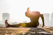 © Jovo Jovanovic/Stocksy - Silhouette of man practicing yoga ekapada shirshasana pose