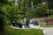 © Rob and Julia Campbell/Stocksy - Patio with firepit after landscaping and concrete work.