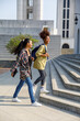© Jovo Jovanovic/Stocksy - Girl students having fun talk while walking upstairs at college campus