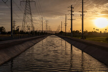 Chandler Arizona Canal At Sunset Powerlines And Telephone Poles In Background
