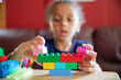 © Anya Brewley Schultheiss/Stocksy - Closeup of blocks being assembled by a child