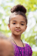 © Anya Brewley Schultheiss/Stocksy - Pretty girl with a funny facial expression looking towards her sister